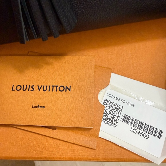 Louis Vuitton Black Pebbled Leather Tote with Silver LV Accent and Tassels - Picture 3 of 3